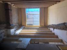 Surélévation d'une maison avec charpente toit plat en bois à Marseillan